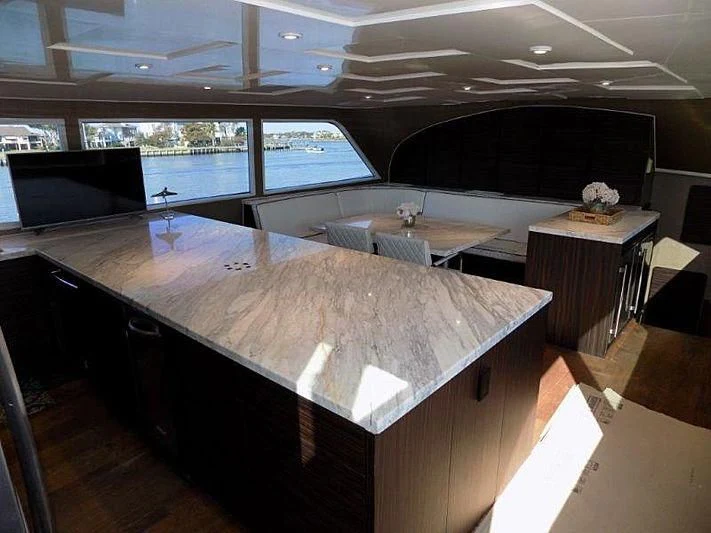 a room with a large table aboard LADY P Yacht for Sale