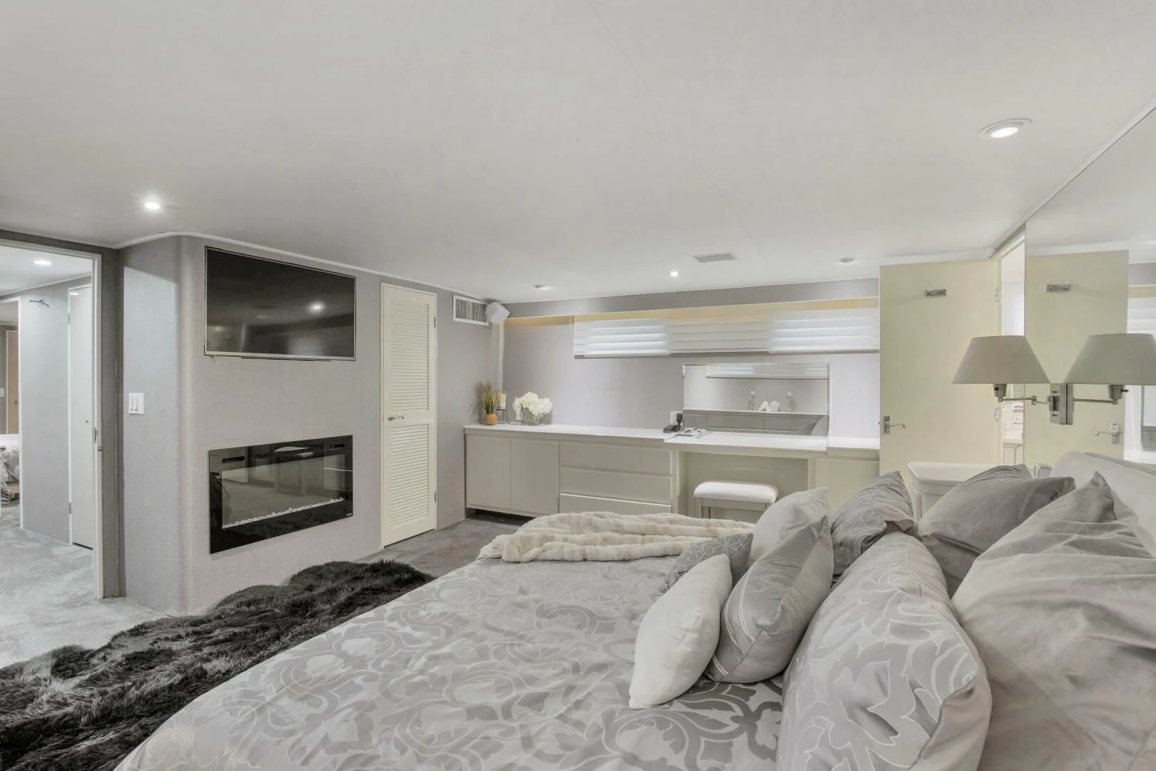 a bedroom with a bed and a television aboard LADY P Yacht for Sale