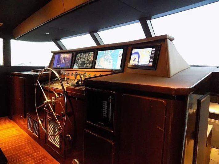 a room with computers and monitors aboard LADY P Yacht for Sale