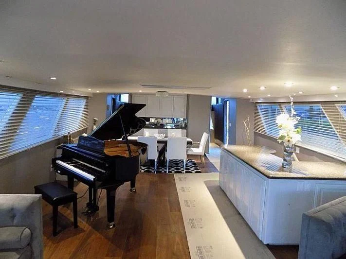 a piano in a room aboard LADY P Yacht for Sale