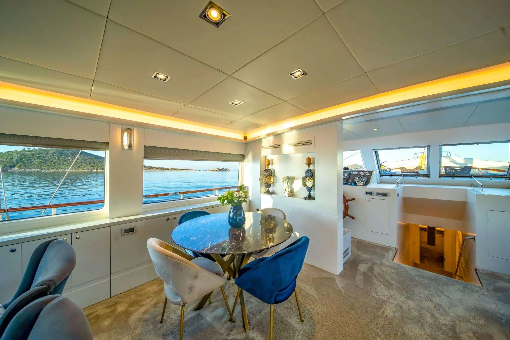 a kitchen with a table and chairs aboard DOUBLE EAGLE Yacht for Sale