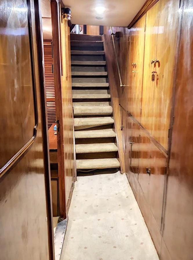 a hallway with wooden doors aboard ELIKI Yacht for Sale