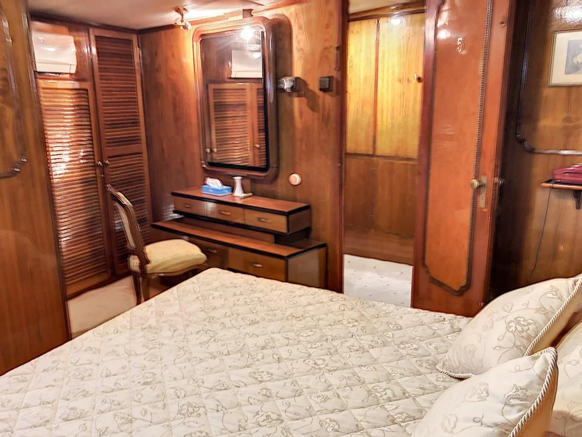 a bed in a room aboard ELIKI Yacht for Sale