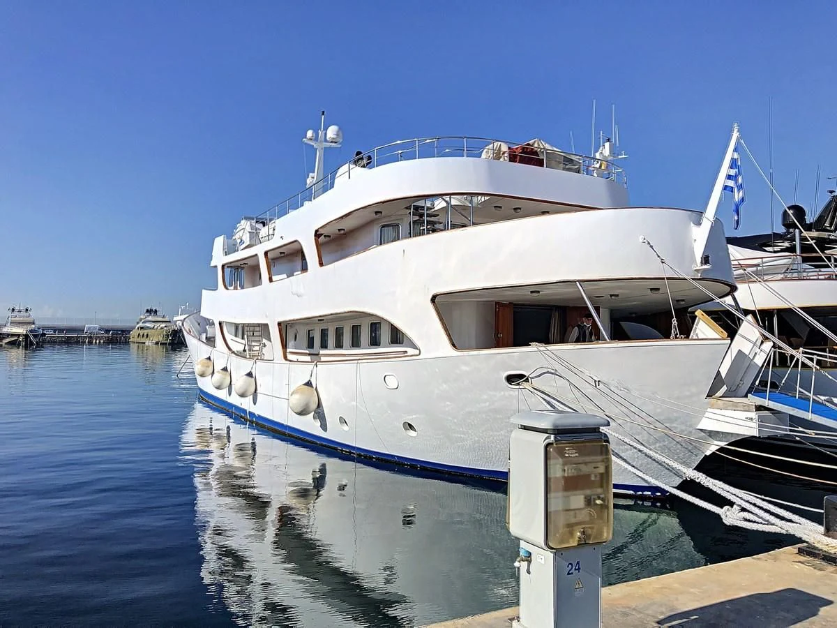 a large white boat in the water aboard ELIKI Yacht for Sale