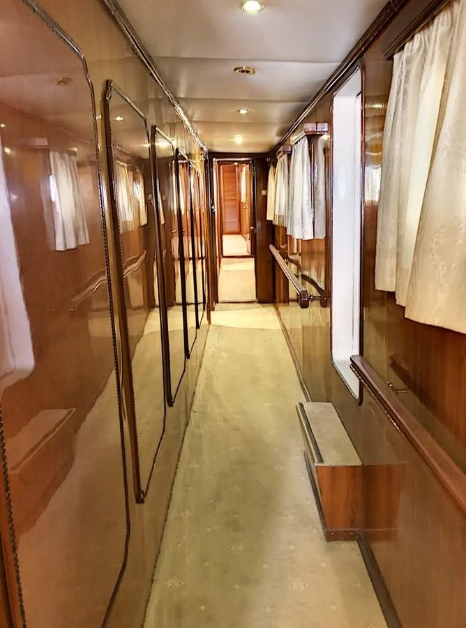 a hallway with a row of lockers aboard ELIKI Yacht for Sale