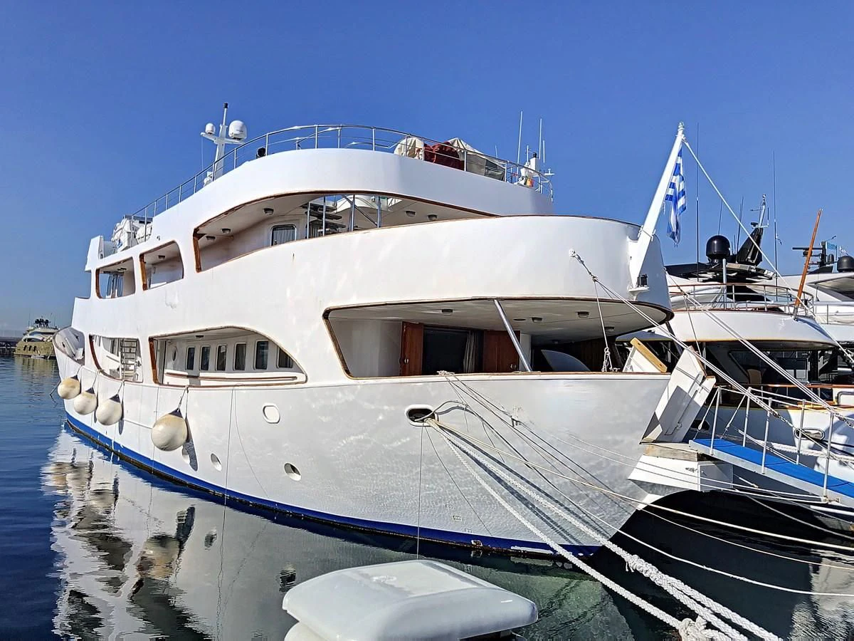 a large white boat in the water aboard ELIKI Yacht for Sale