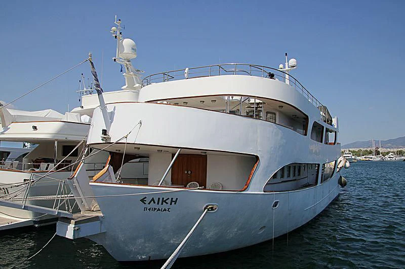 a white boat on the water aboard ELIKI Yacht for Sale