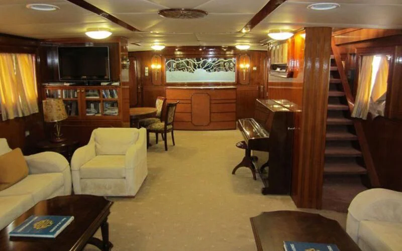 a room with a wood door and a wood staircase aboard ELIKI Yacht for Sale