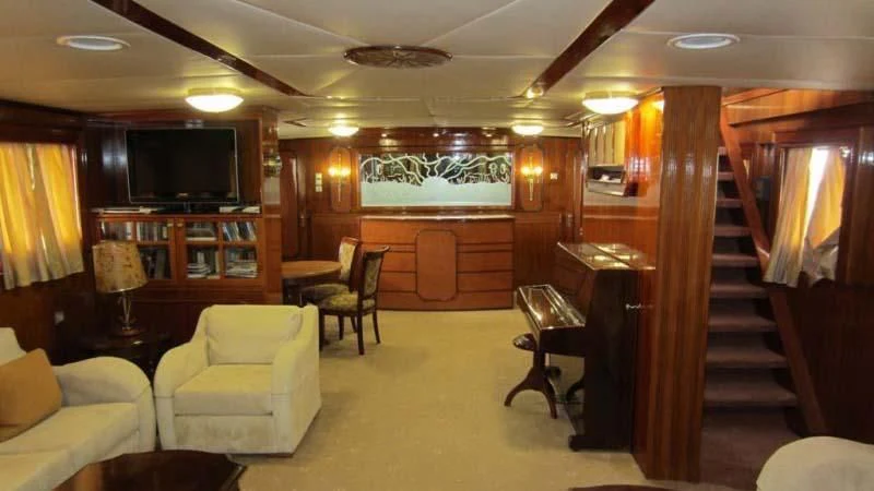 a room with a wood floor and a wood door aboard ELIKI Yacht for Sale