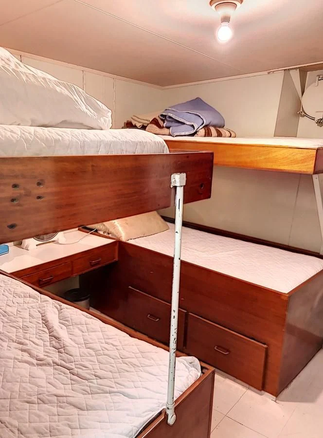 a couple of beds in a hotel room aboard ELIKI Yacht for Sale