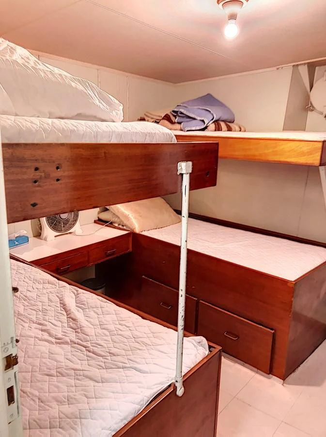 a room with bunk beds aboard ELIKI Yacht for Sale