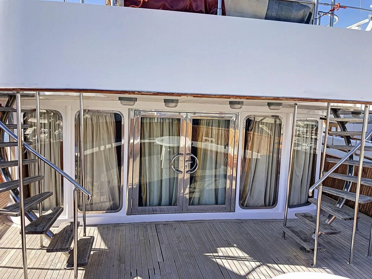 a train with glass doors aboard ELIKI Yacht for Sale