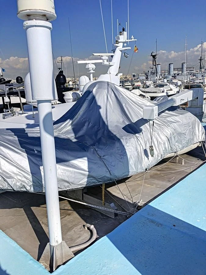 a large blue and white flag on a pole aboard ELIKI Yacht for Sale