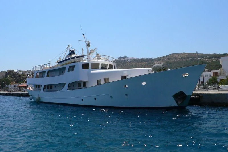 a large white boat in the water aboard ELIKI Yacht for Sale