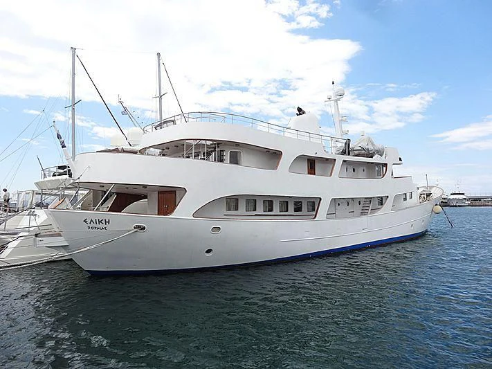 a large white boat in the water aboard ELIKI Yacht for Sale