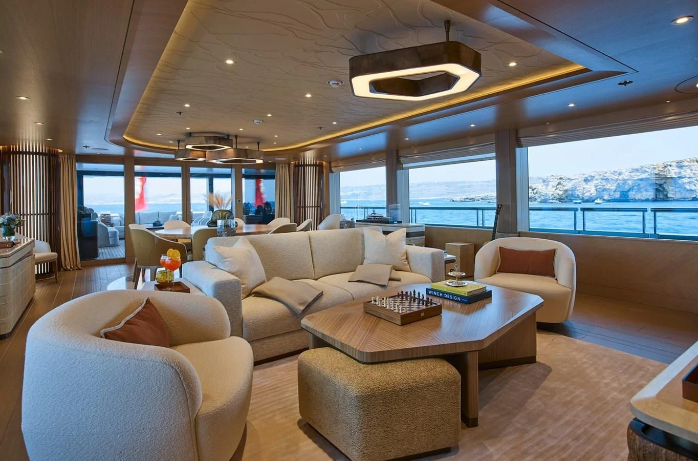 a living room with a large window aboard COME TOGETHER Yacht for Charter