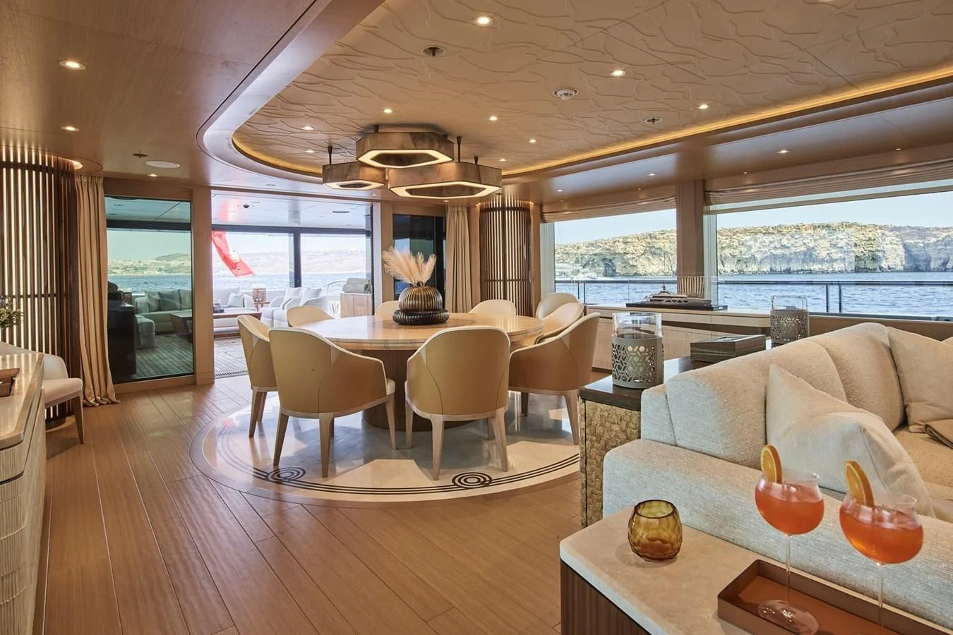 a living room with a table and chairs aboard COME TOGETHER Yacht for Charter