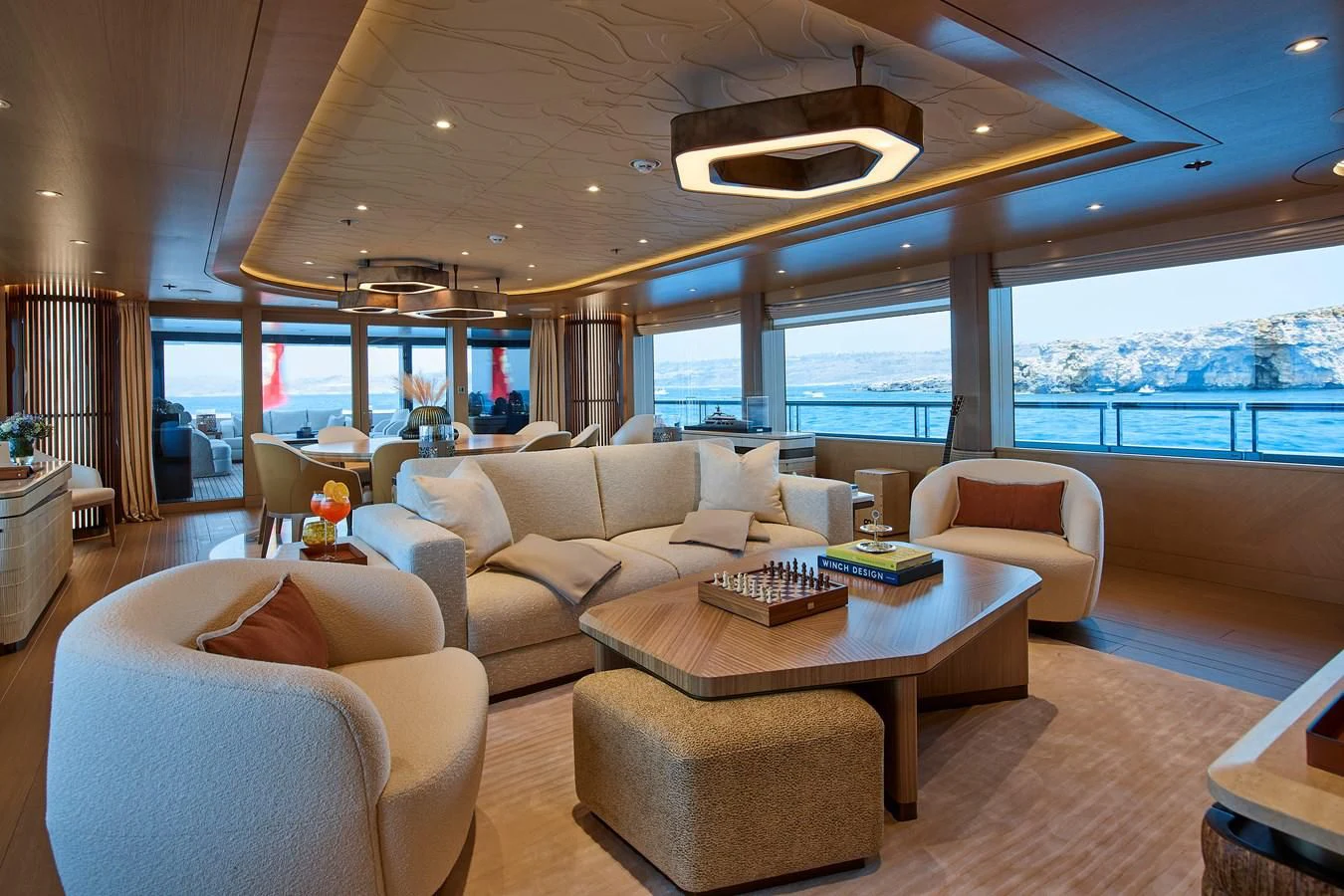 a living room with a large window aboard COME TOGETHER Yacht for Charter