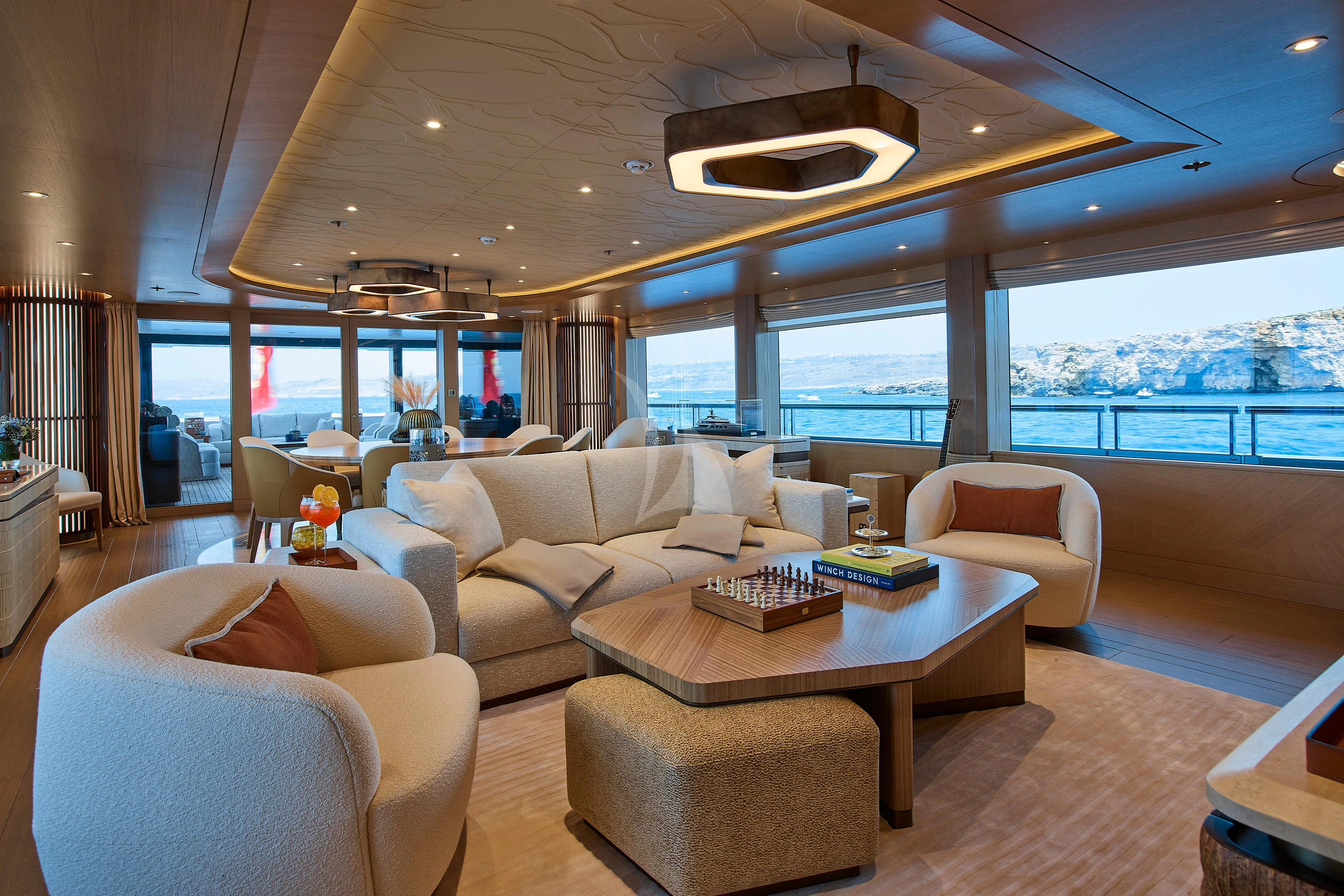 a living room with a large window aboard COME TOGETHER Yacht for Charter
