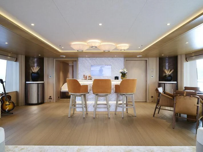 a large kitchen with a dining table aboard COME TOGETHER Yacht for Charter