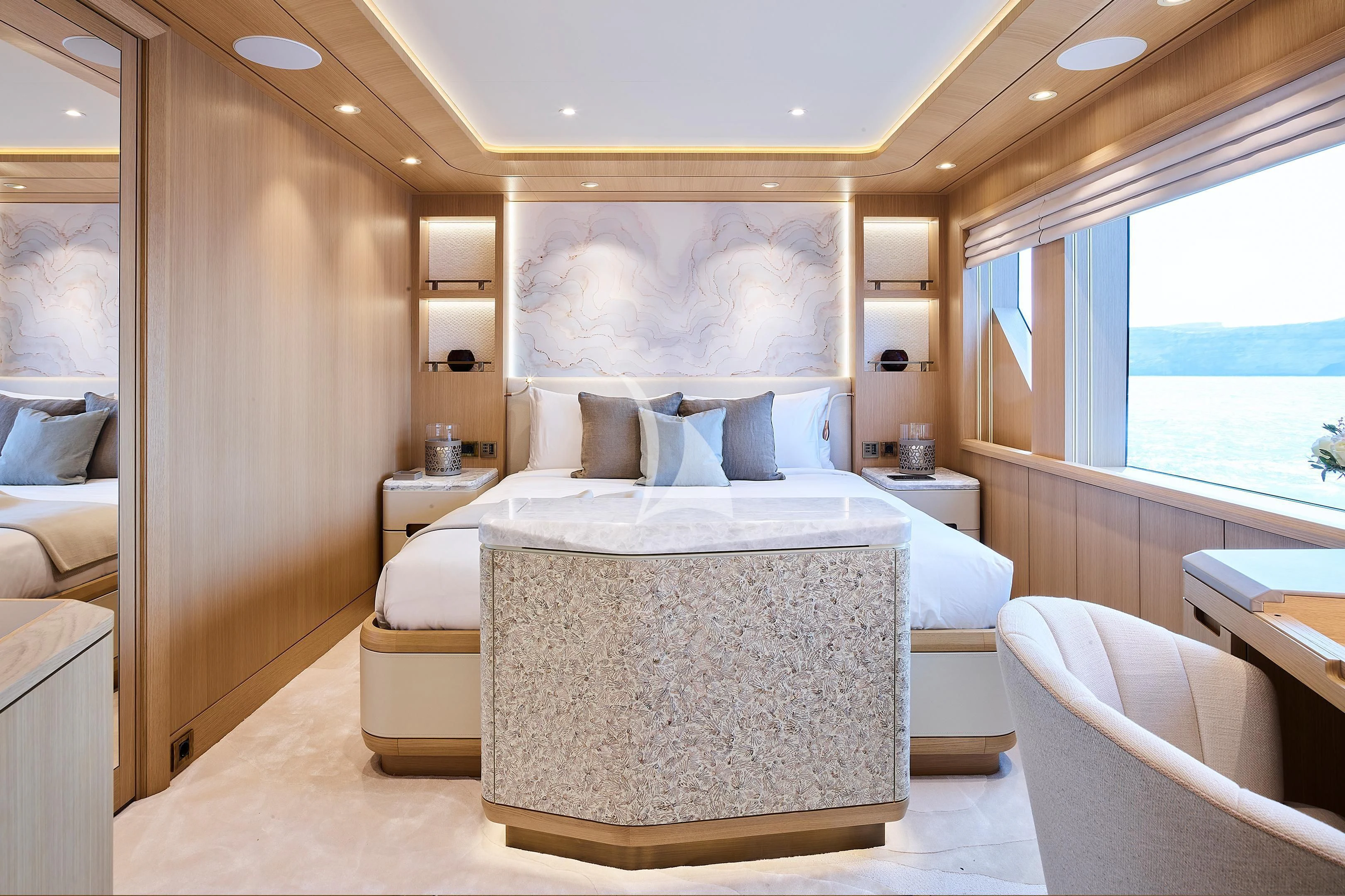 a room with a bed and a window aboard COME TOGETHER Yacht for Charter