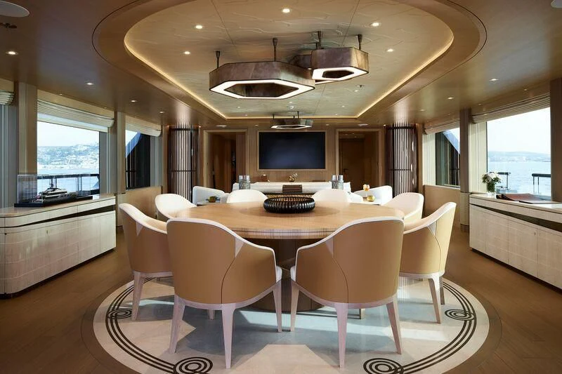 a dining room with a table and chairs aboard COME TOGETHER Yacht for Charter