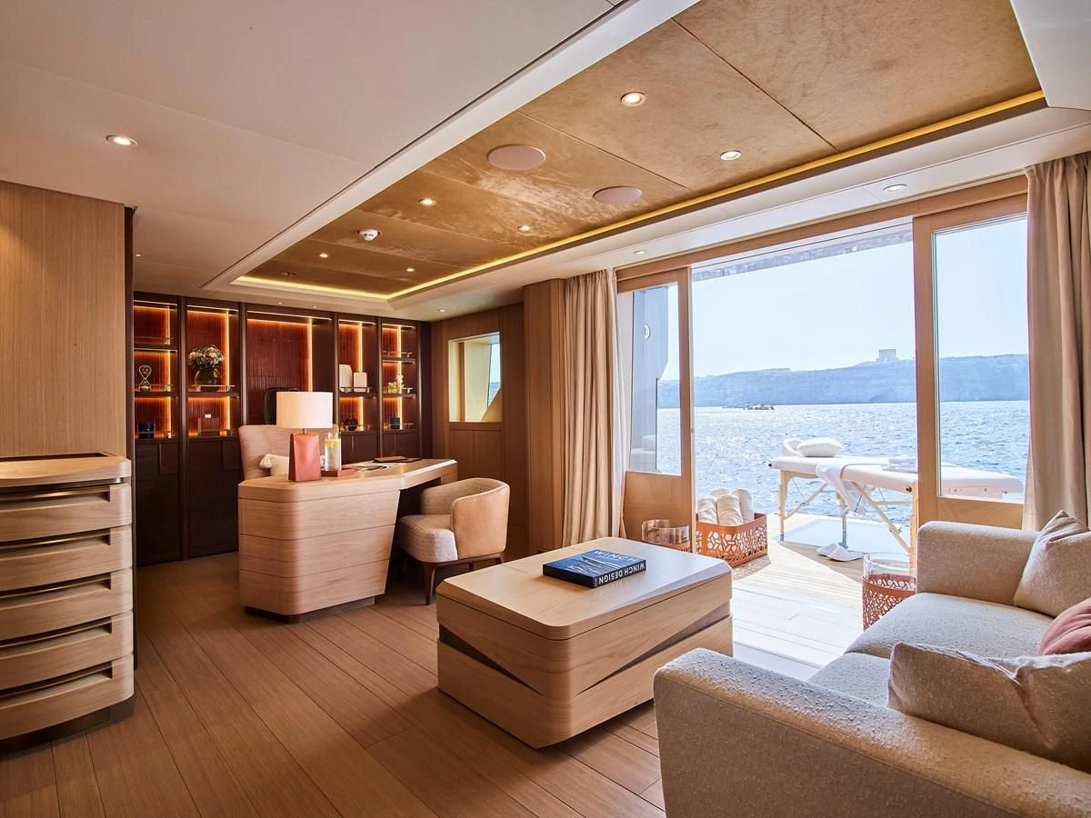 a living room with a large window aboard COME TOGETHER Yacht for Charter