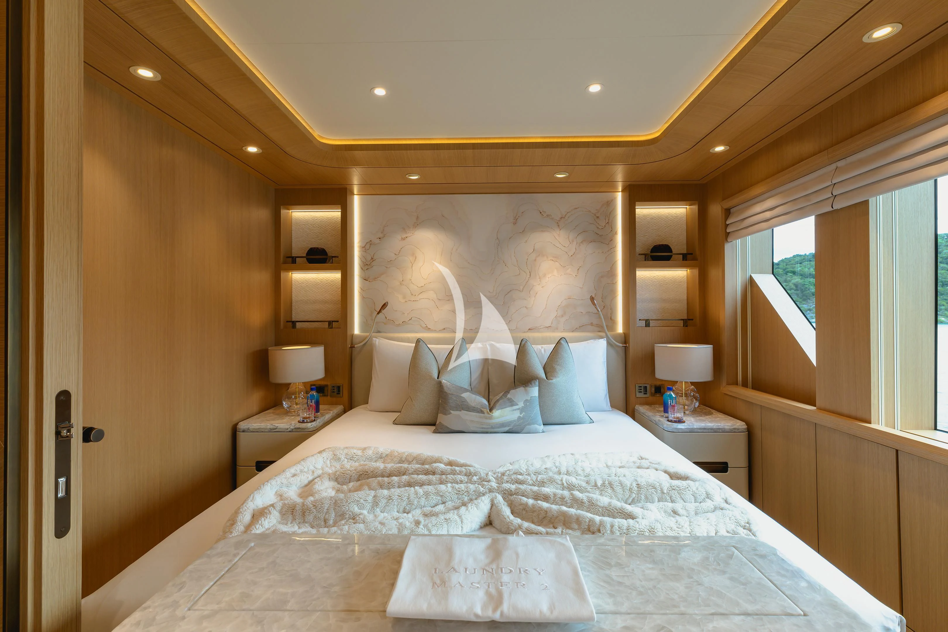 a bed with white sheets aboard COME TOGETHER Yacht for Charter