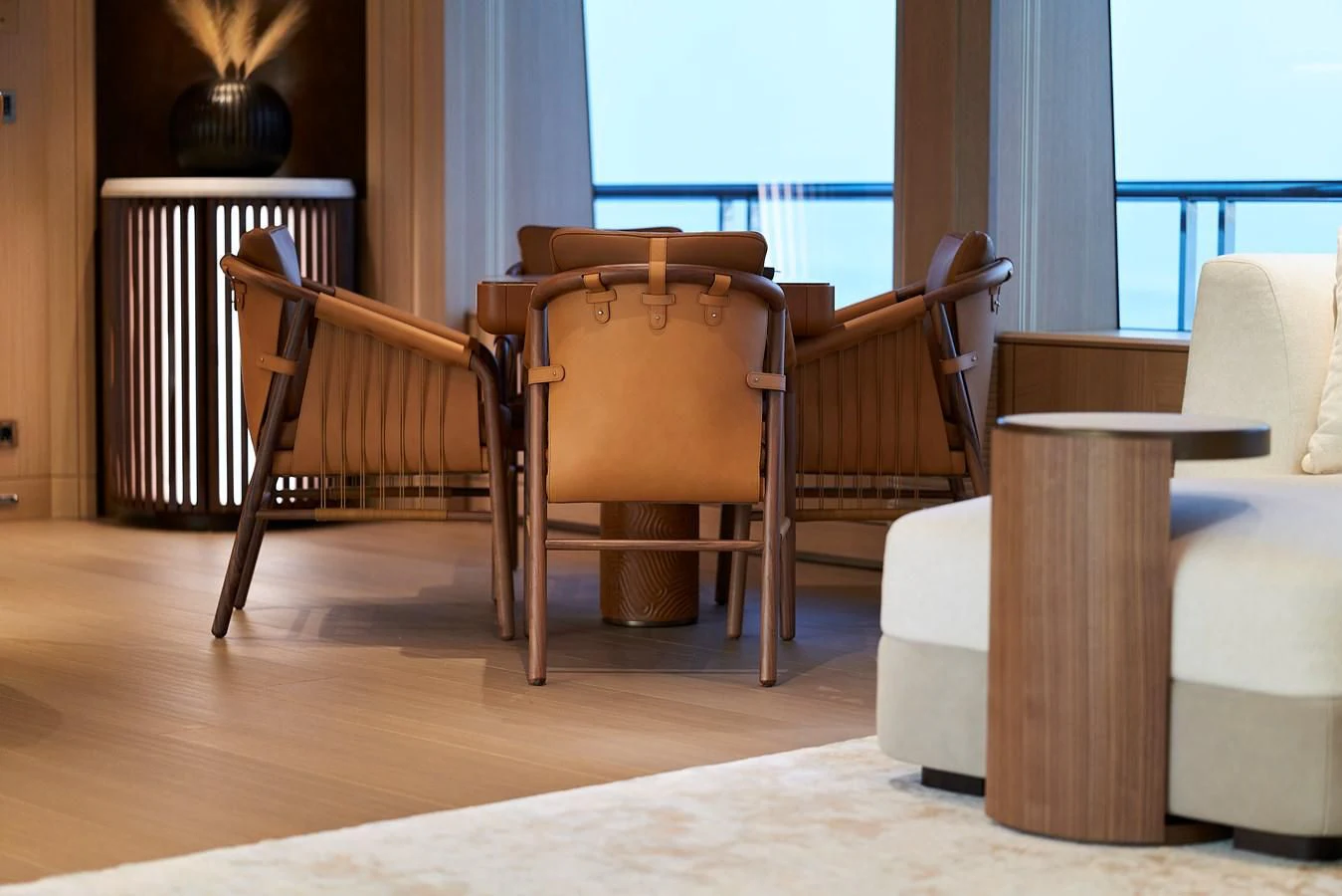 a wooden chair next to a table aboard COME TOGETHER Yacht for Charter
