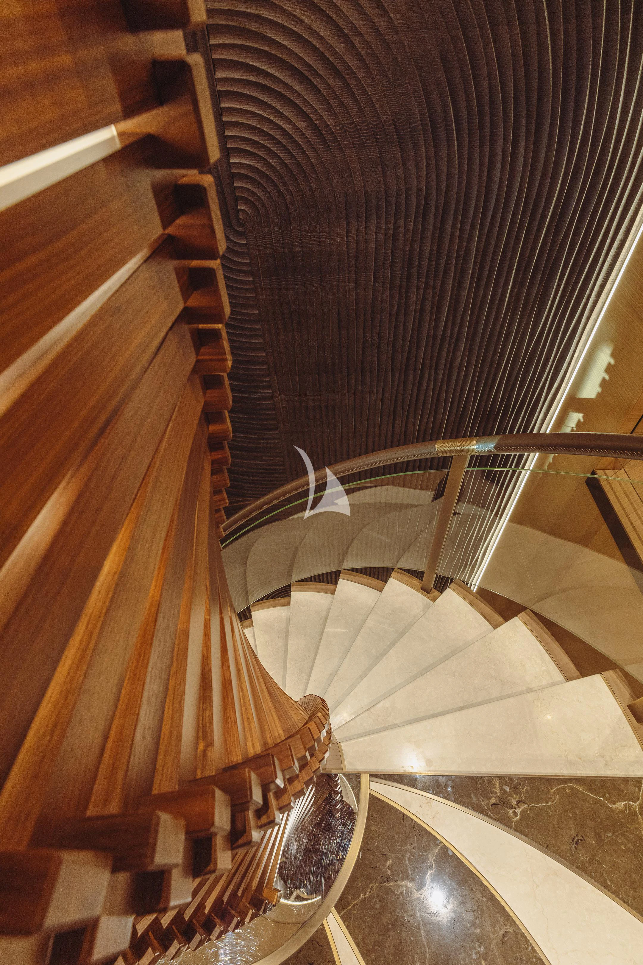 a spiral staircase with a railing aboard COME TOGETHER Yacht for Charter