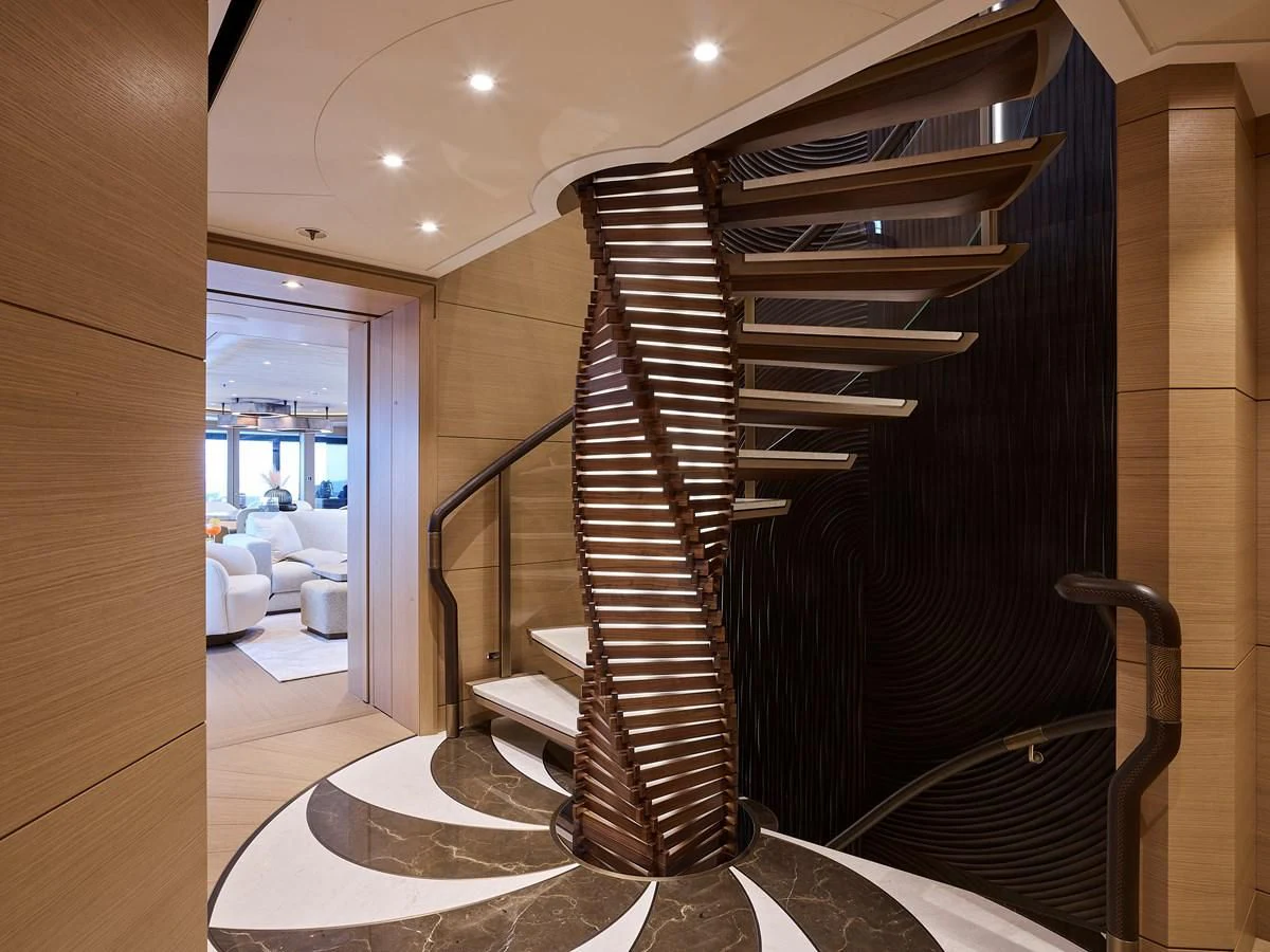 a wood staircase in a room aboard COME TOGETHER Yacht for Charter