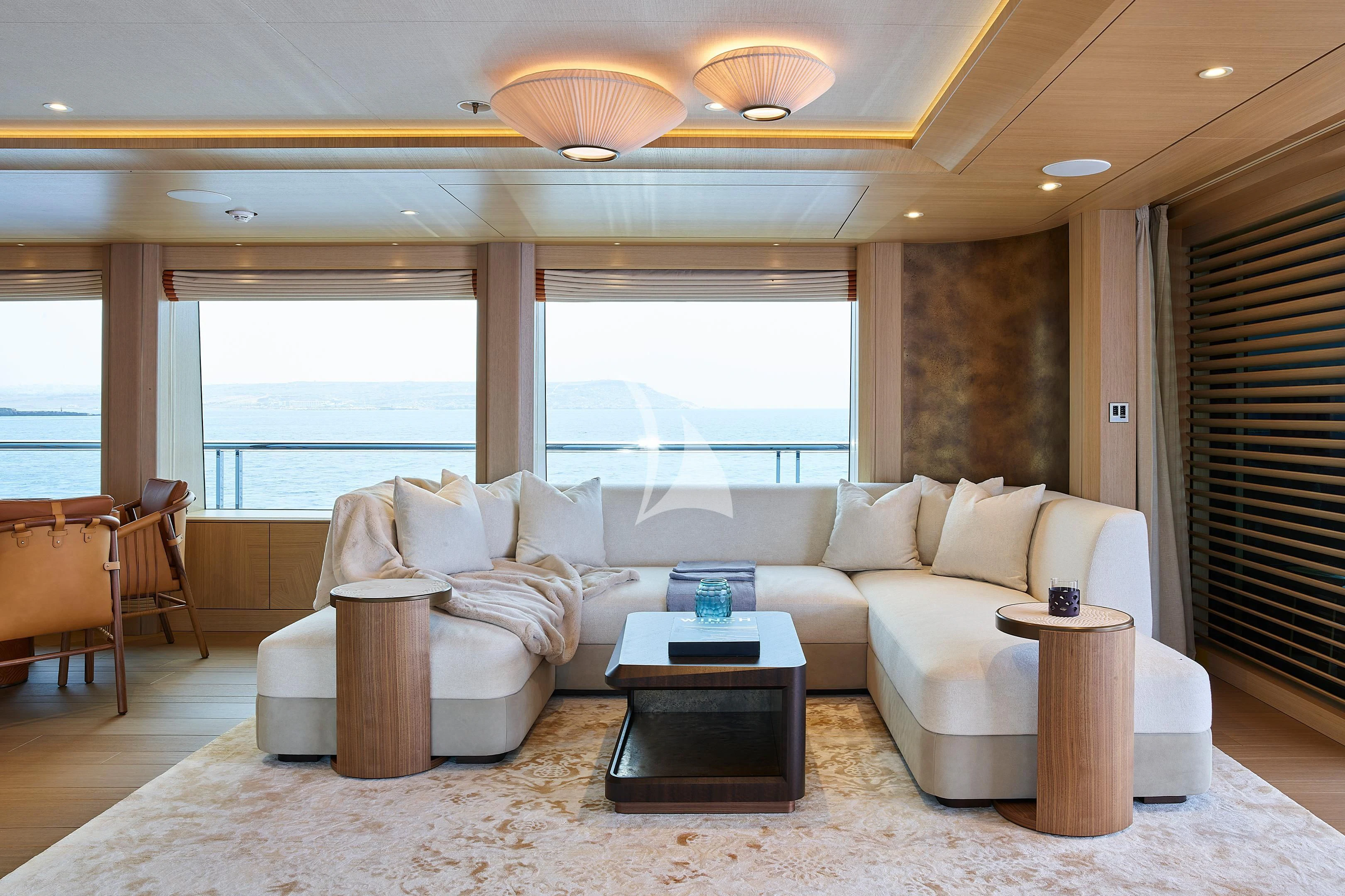 a living room with a large window aboard COME TOGETHER Yacht for Charter