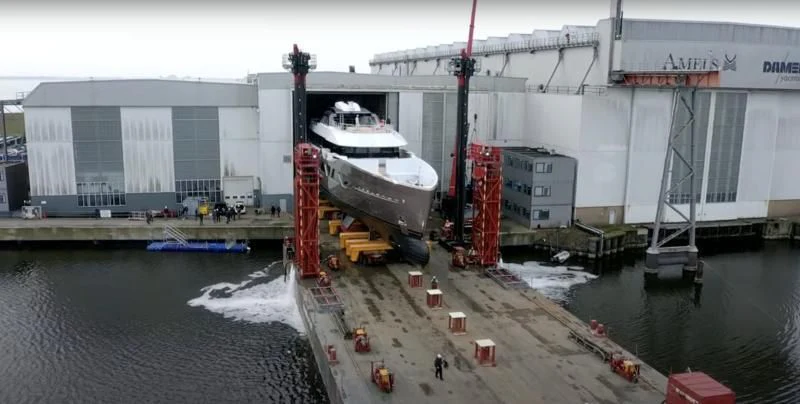 a large white boat is parked in a dock aboard COME TOGETHER Yacht for Charter