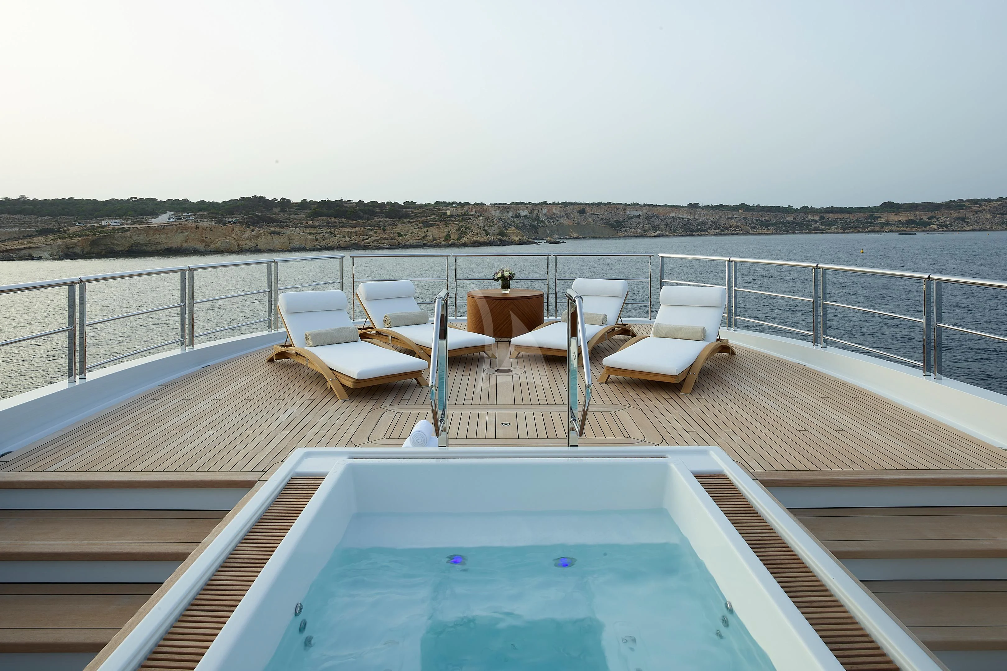 a deck with chairs and tables aboard COME TOGETHER Yacht for Charter
