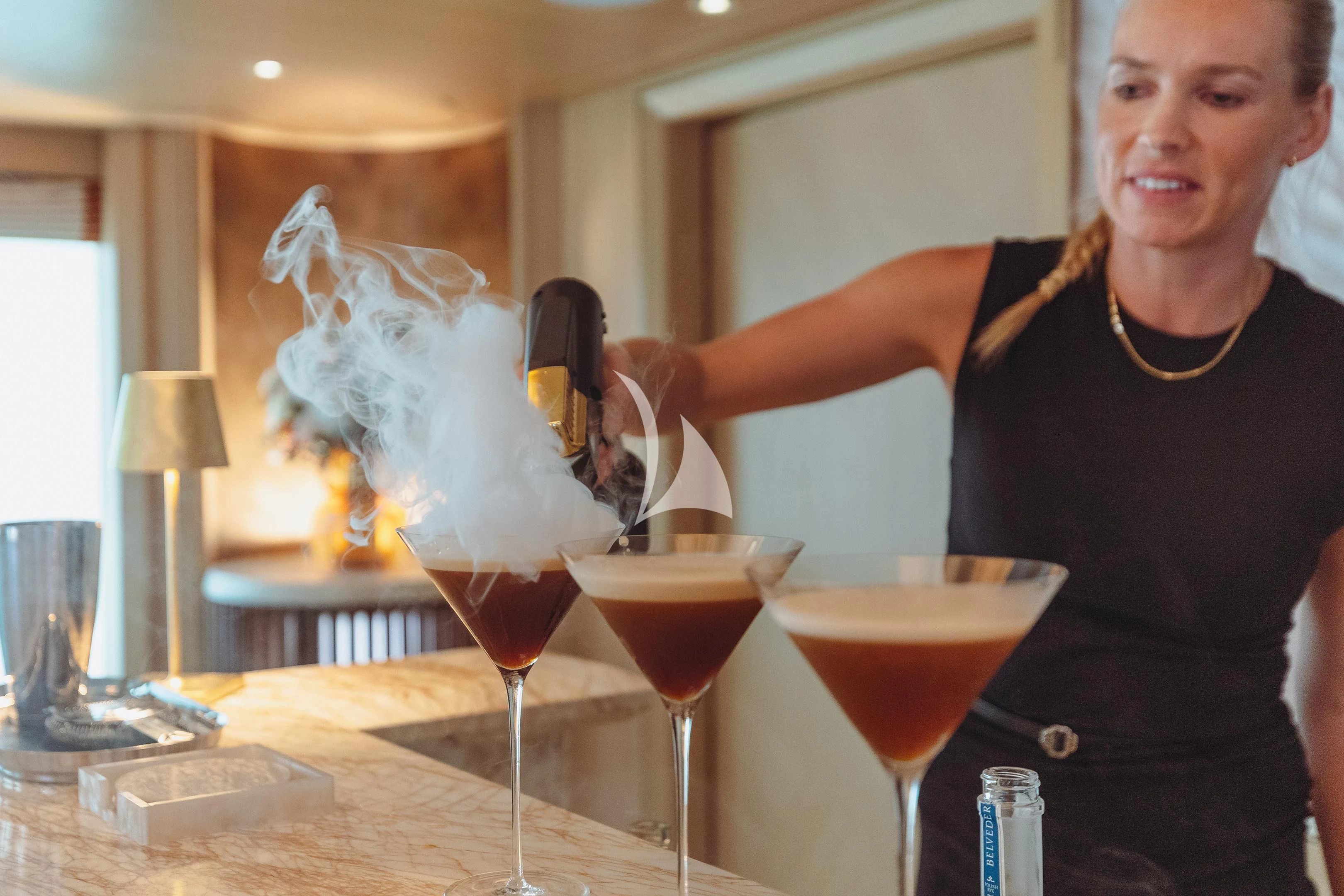 a person holding a wine glass aboard COME TOGETHER Yacht for Charter