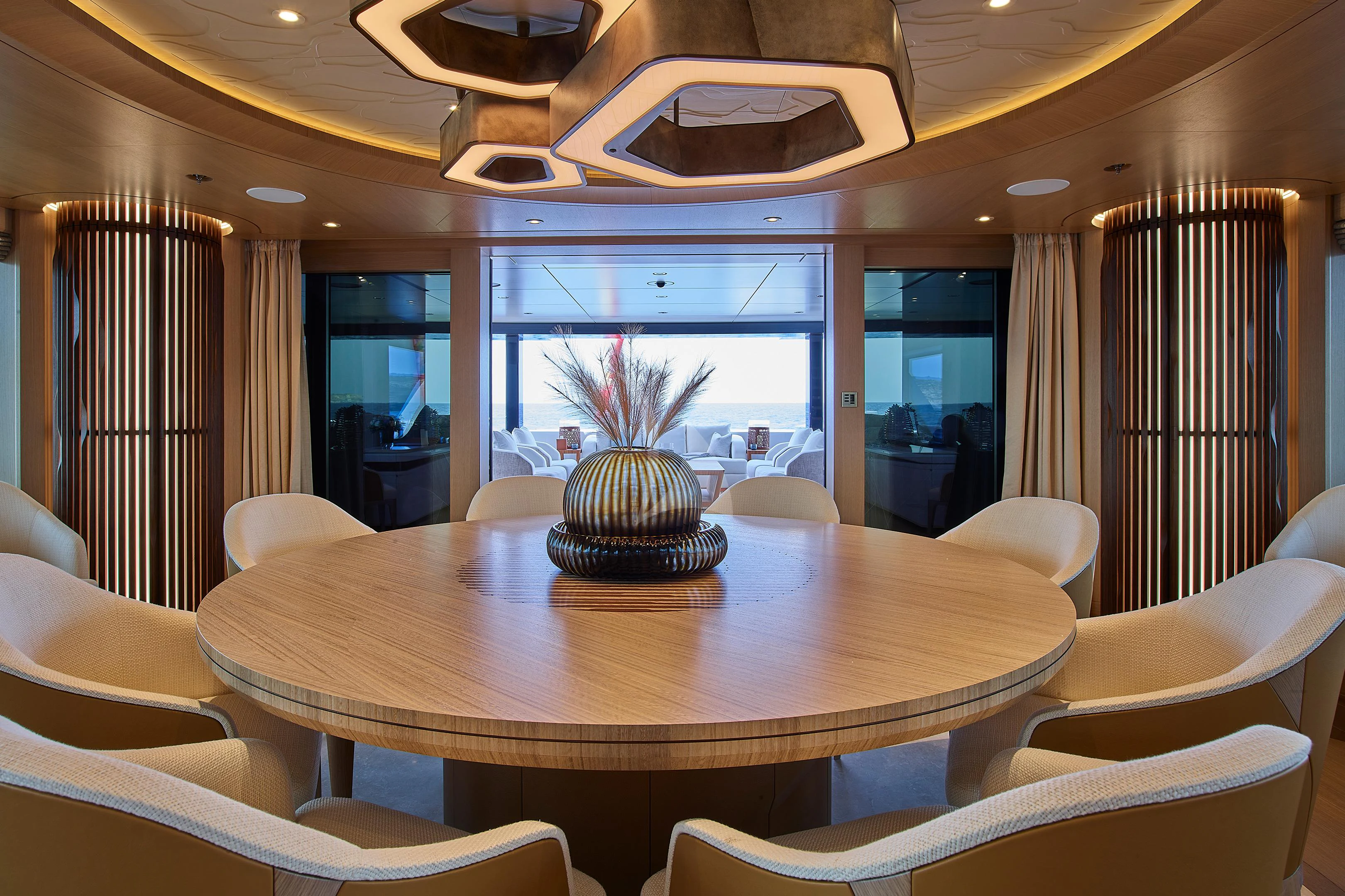a room with a table and chairs aboard COME TOGETHER Yacht for Charter