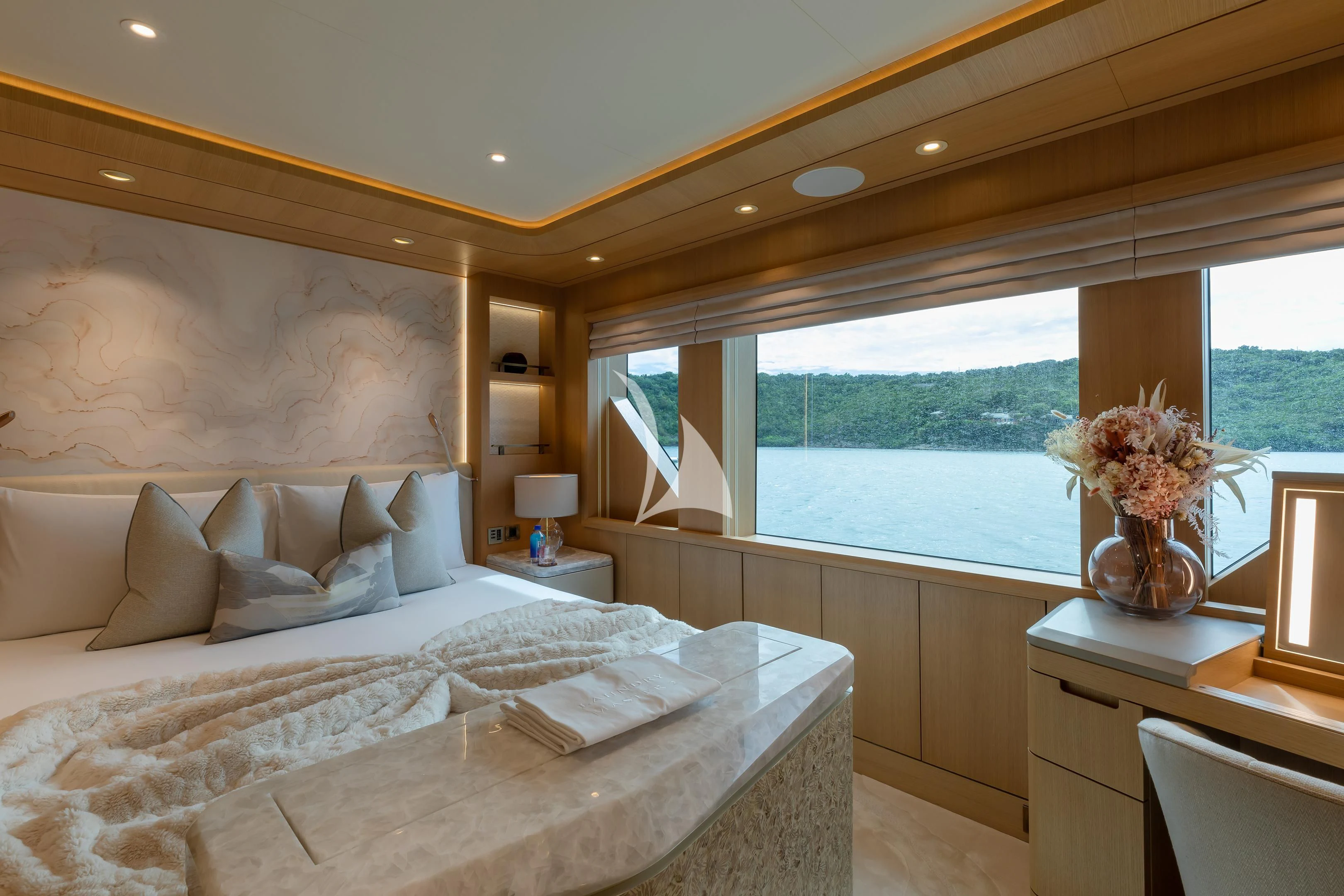 a room with a bed and a window aboard COME TOGETHER Yacht for Charter