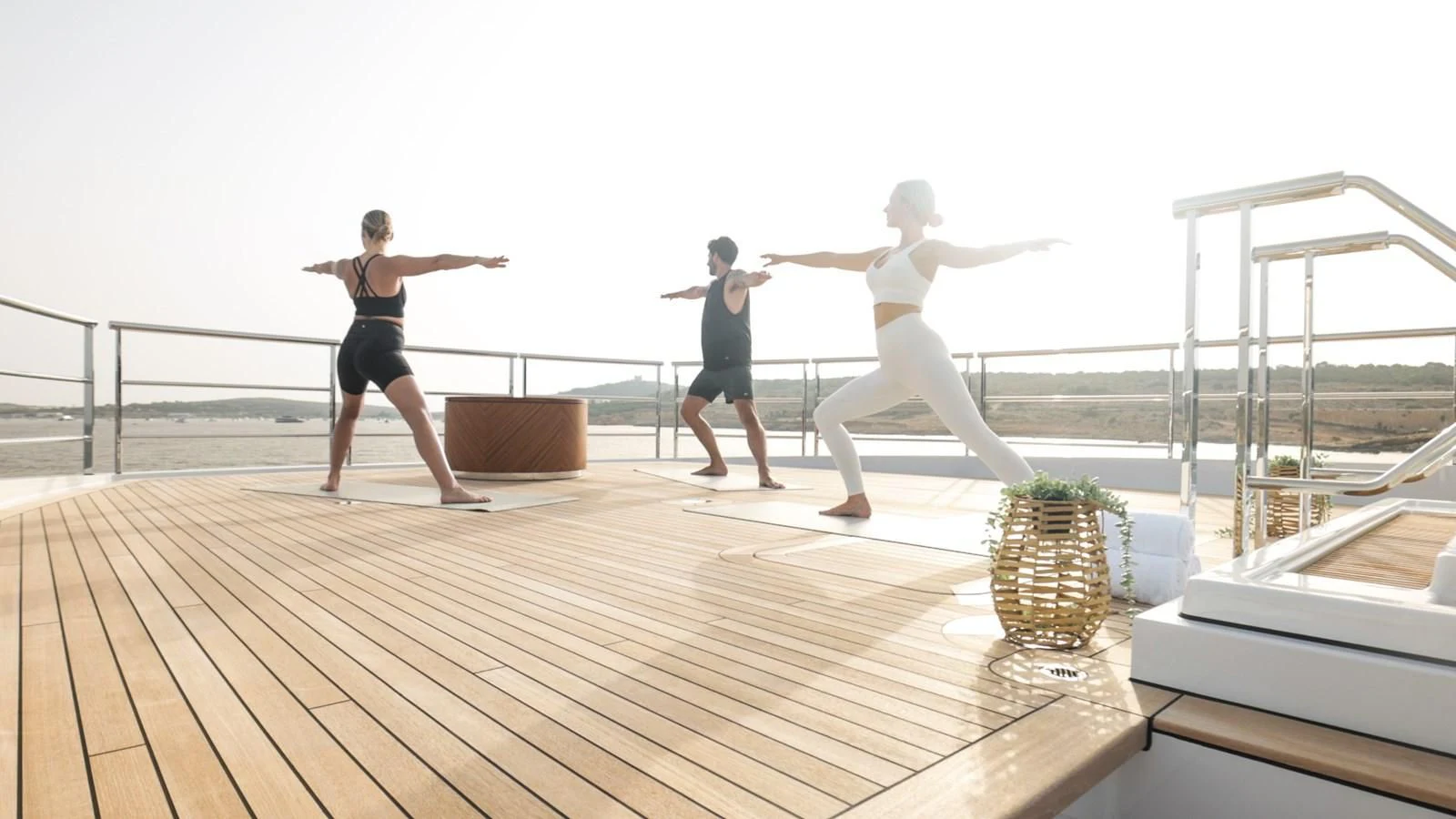 a group of people on a deck aboard COME TOGETHER Yacht for Charter