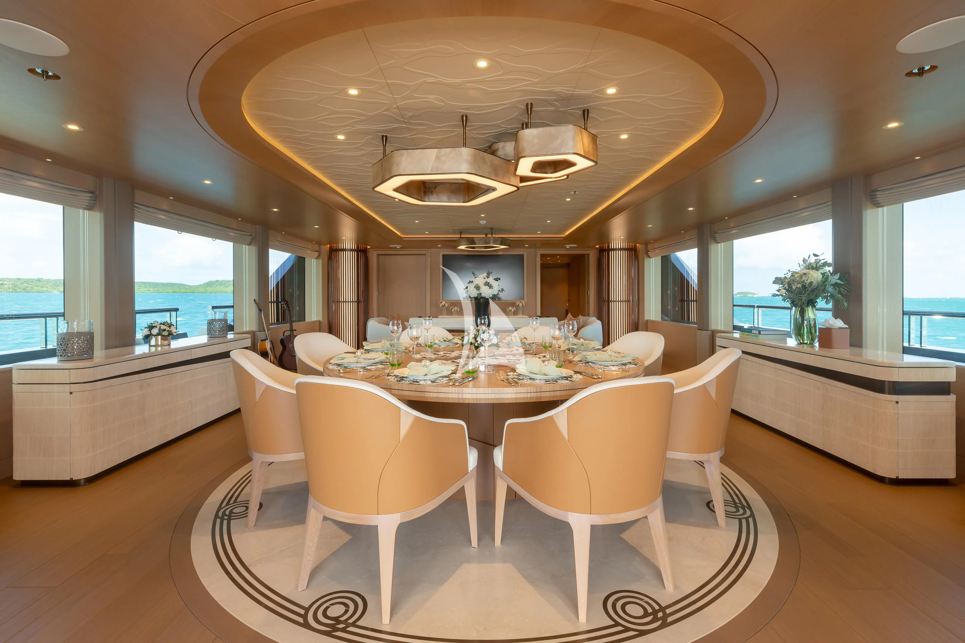 a large dining room with a large table and chairs aboard COME TOGETHER Yacht for Charter