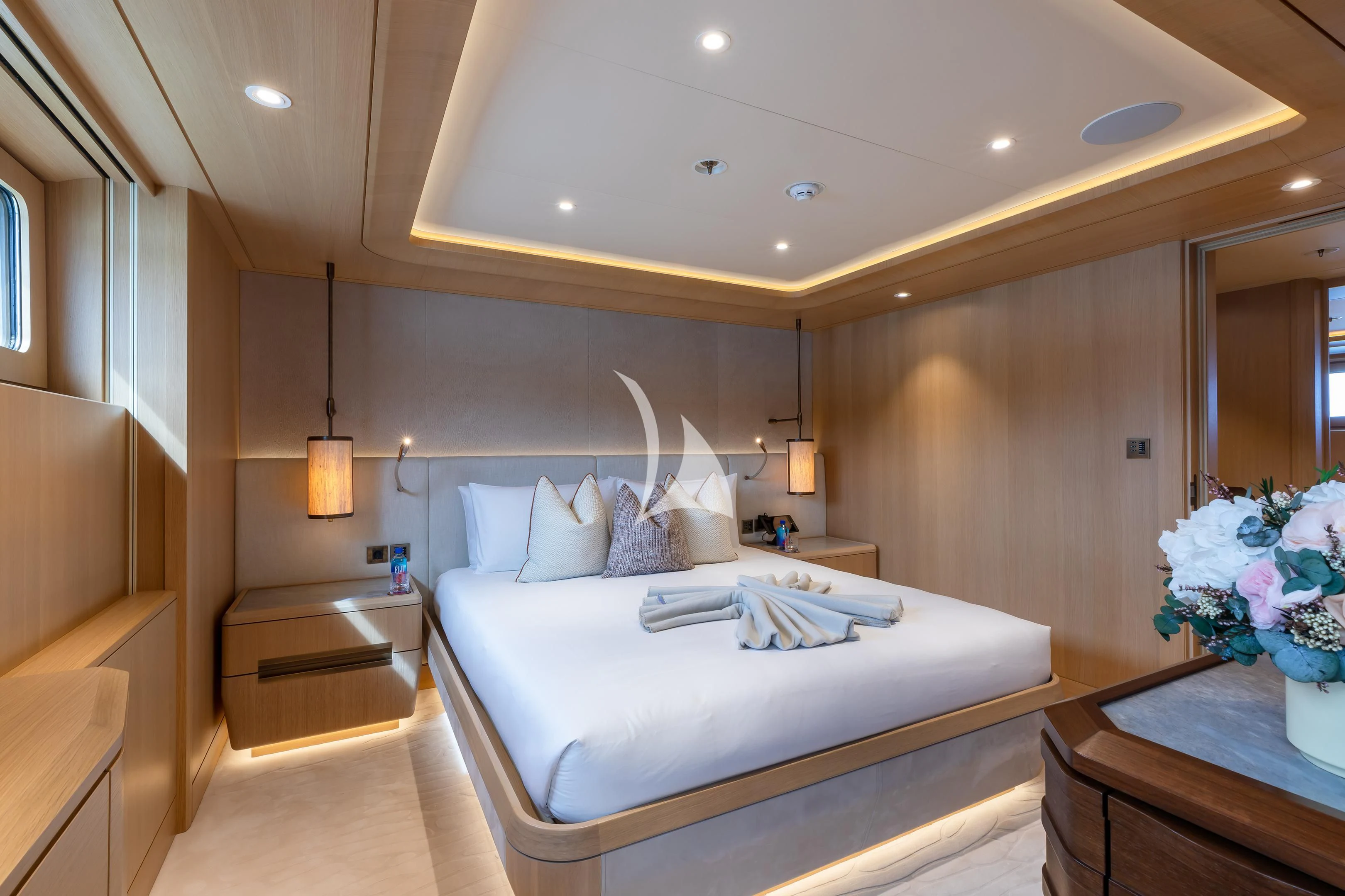 a large white bed in a room aboard COME TOGETHER Yacht for Charter