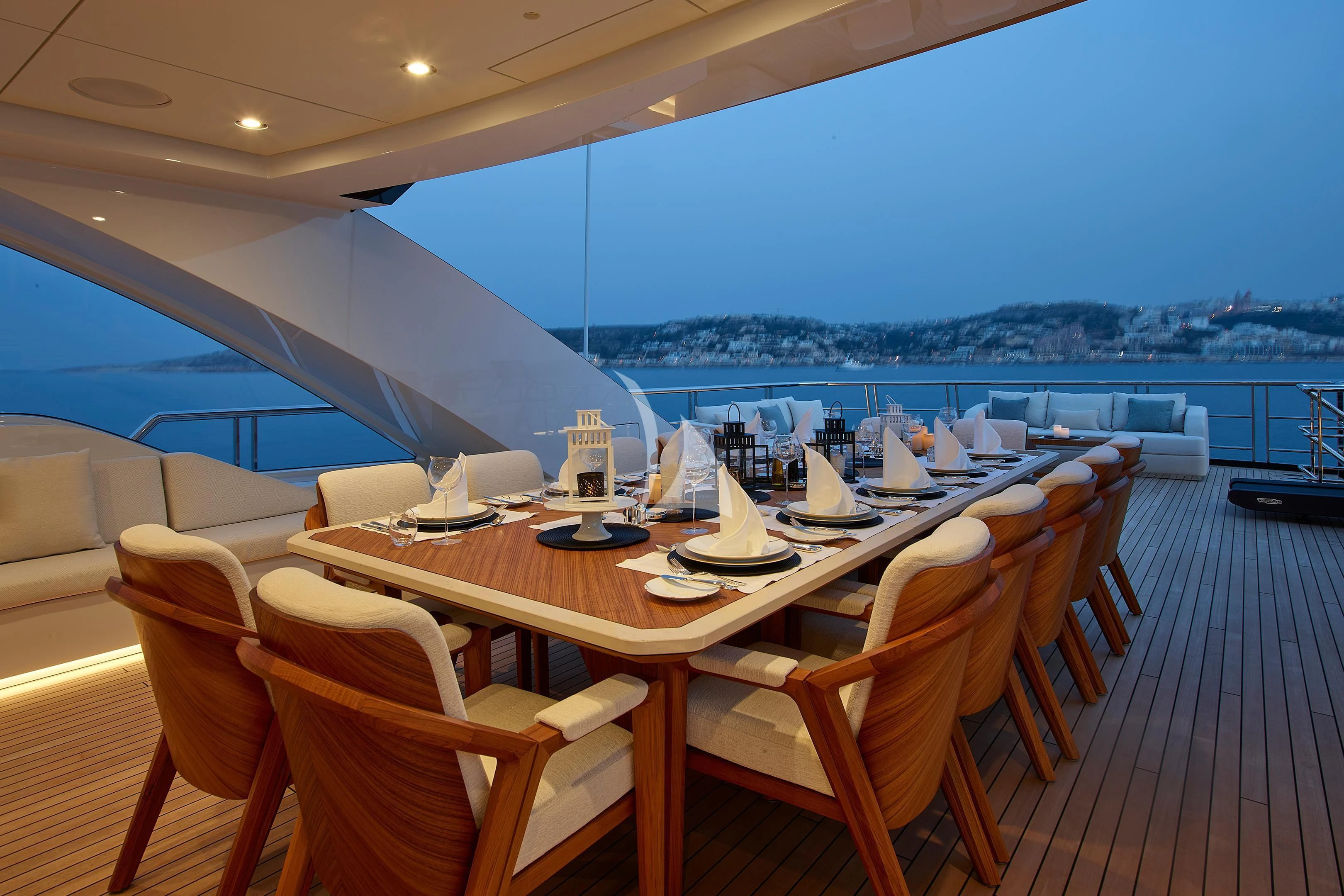 a table set for a meal on a deck aboard COME TOGETHER Yacht for Charter