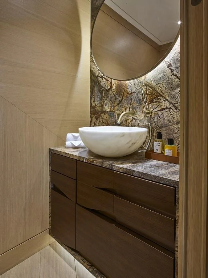 a bathroom with a sink and a mirror aboard COME TOGETHER Yacht for Charter