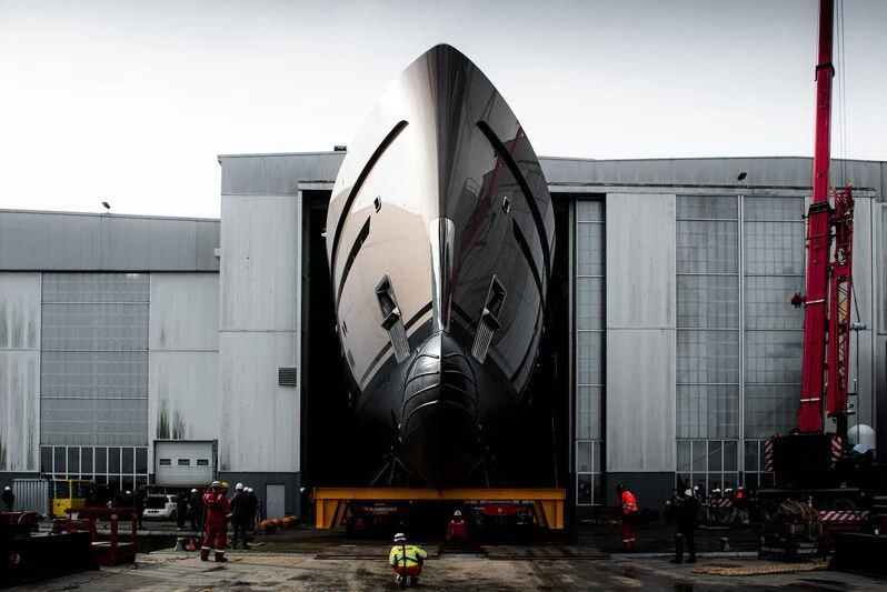 a large building with a large black and white mural on the side aboard COME TOGETHER Yacht for Charter