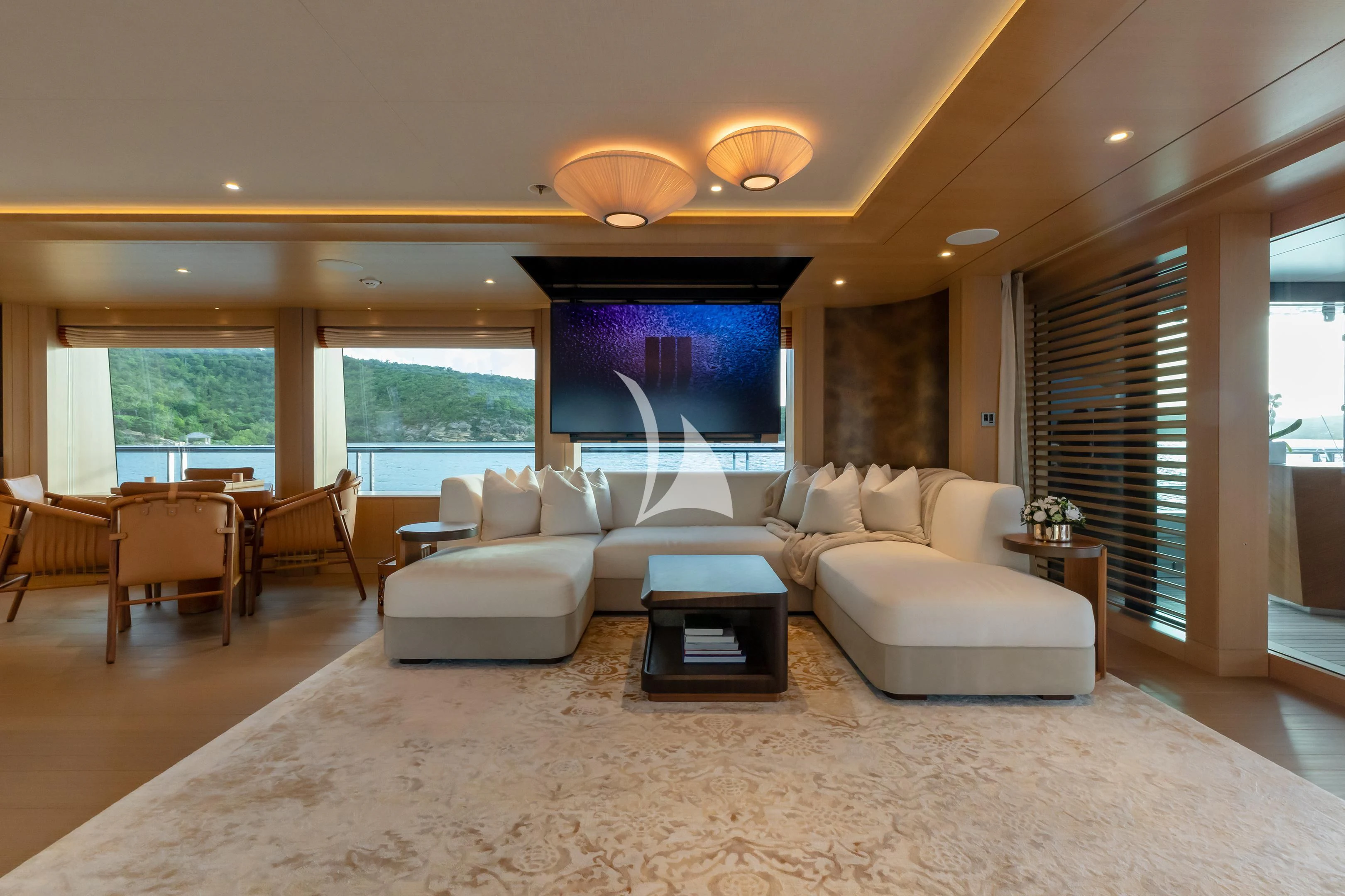 a living room with a large window aboard COME TOGETHER Yacht for Charter