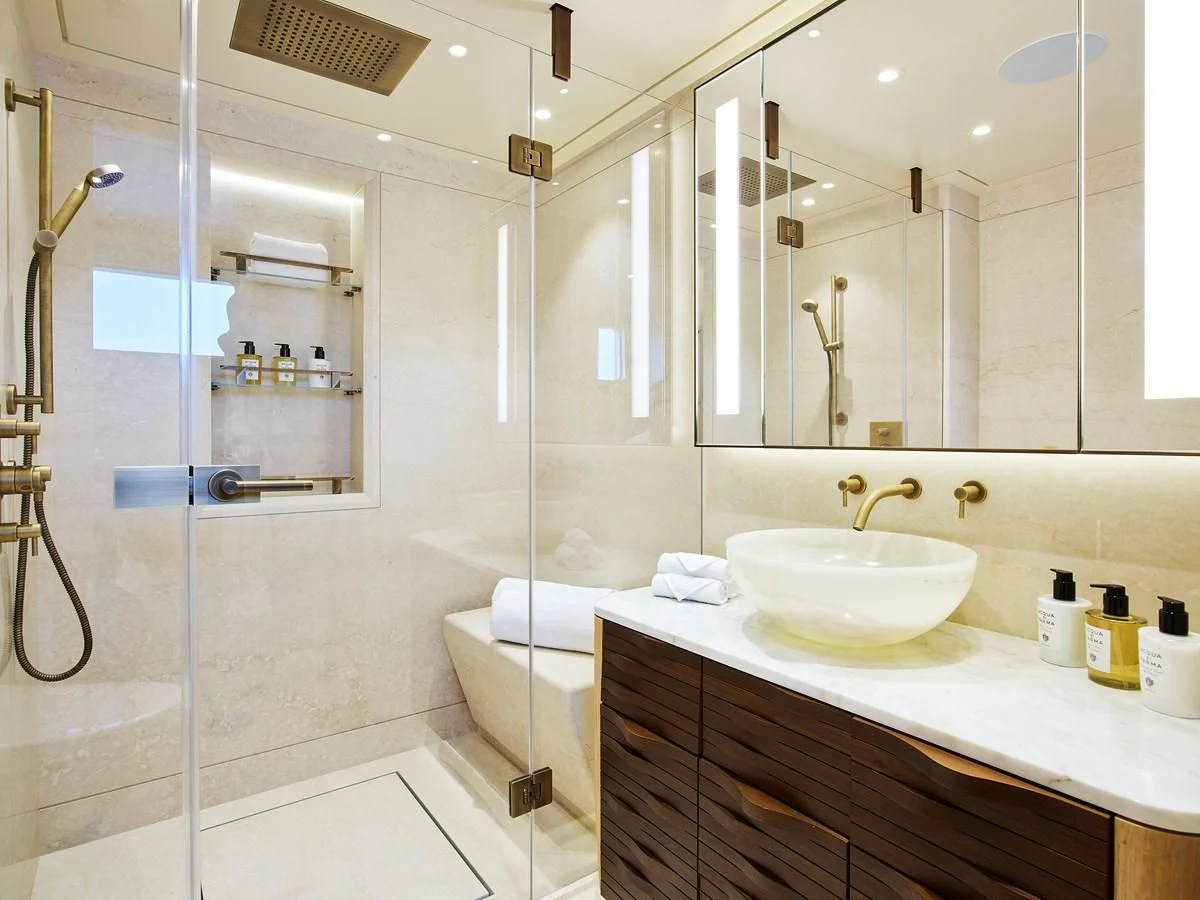 a bathroom with a glass shower aboard COME TOGETHER Yacht for Charter