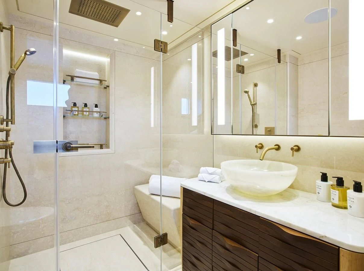 a bathroom with a glass shower aboard COME TOGETHER Yacht for Charter