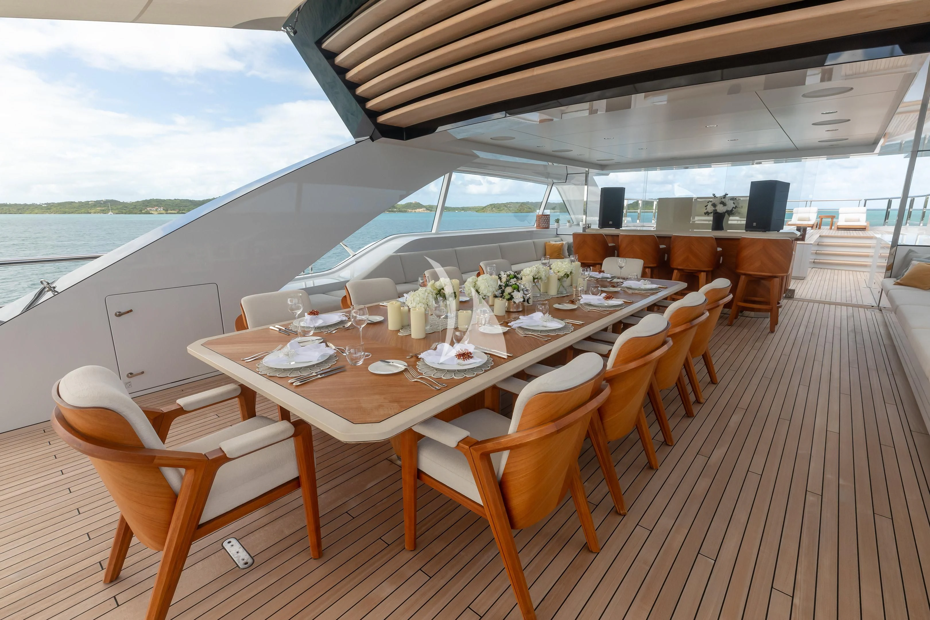 a table set for a meal on a deck aboard COME TOGETHER Yacht for Charter