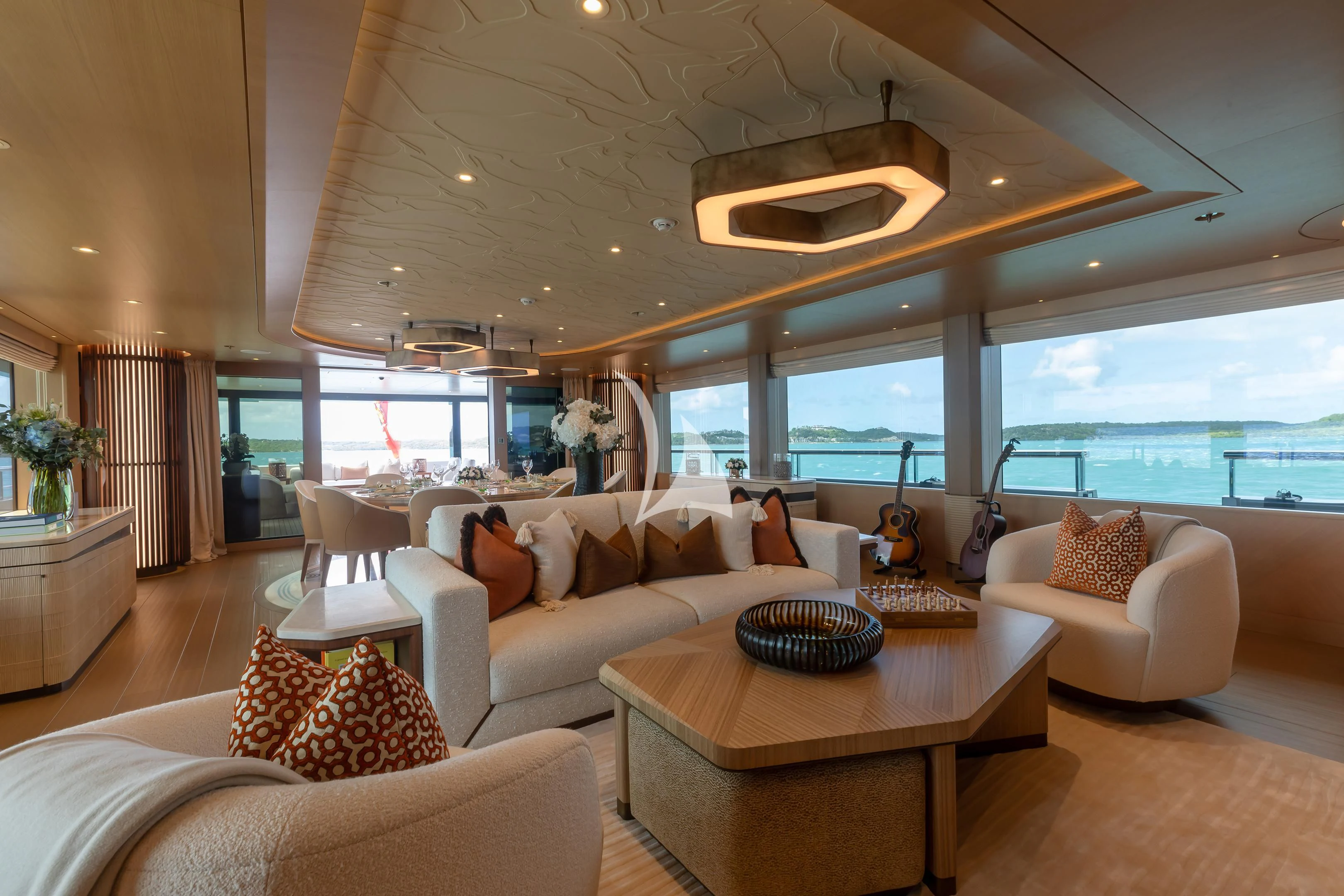 a living room with a large window aboard COME TOGETHER Yacht for Charter