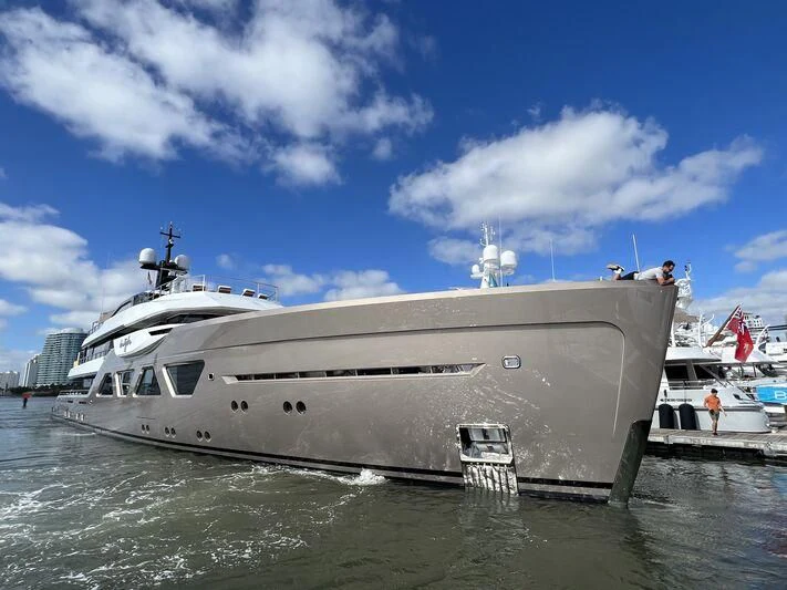 a large white yacht in the water aboard COME TOGETHER Yacht for Charter