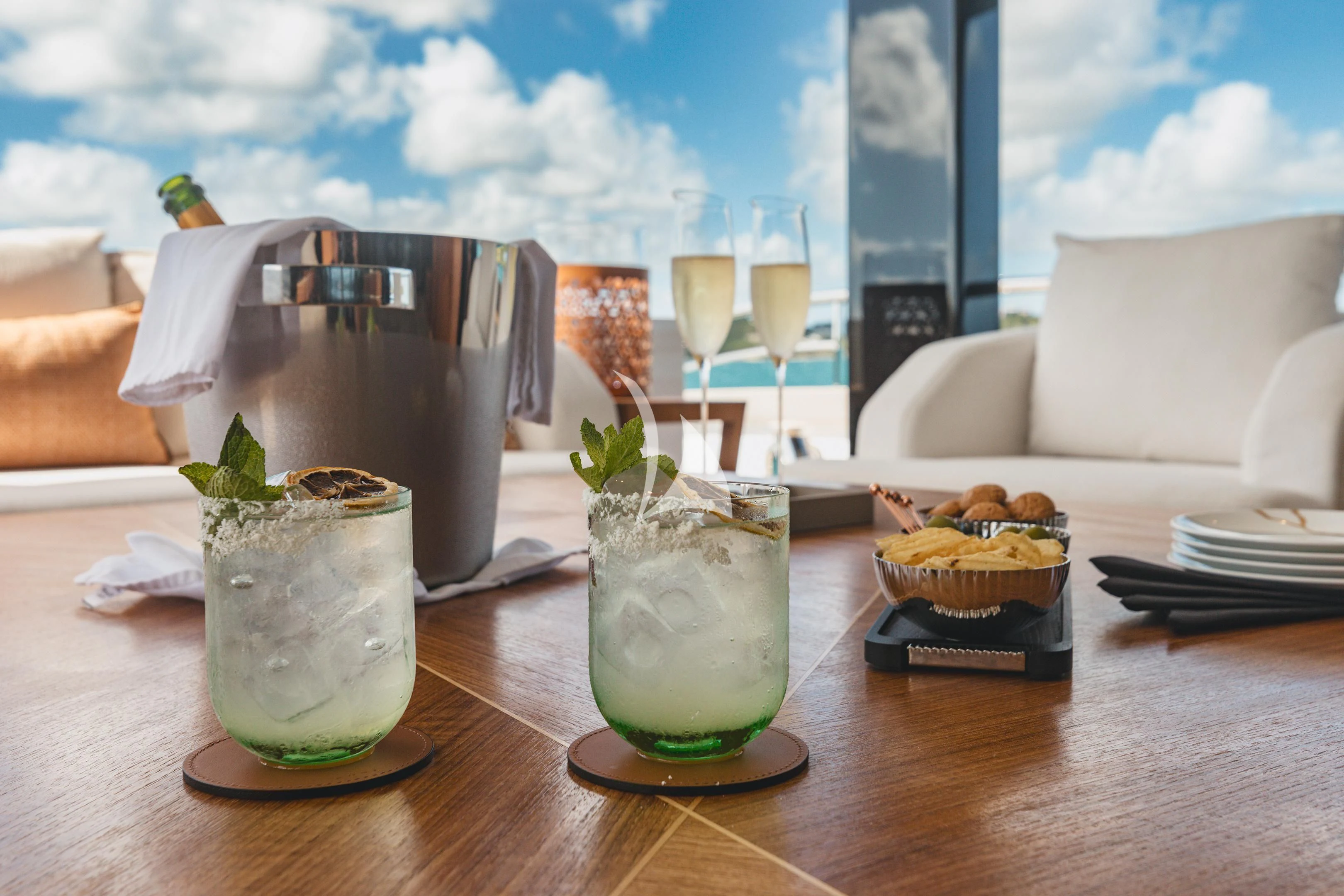 a table with food and drinks on it aboard COME TOGETHER Yacht for Charter